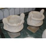 Pair of garden urns on stands