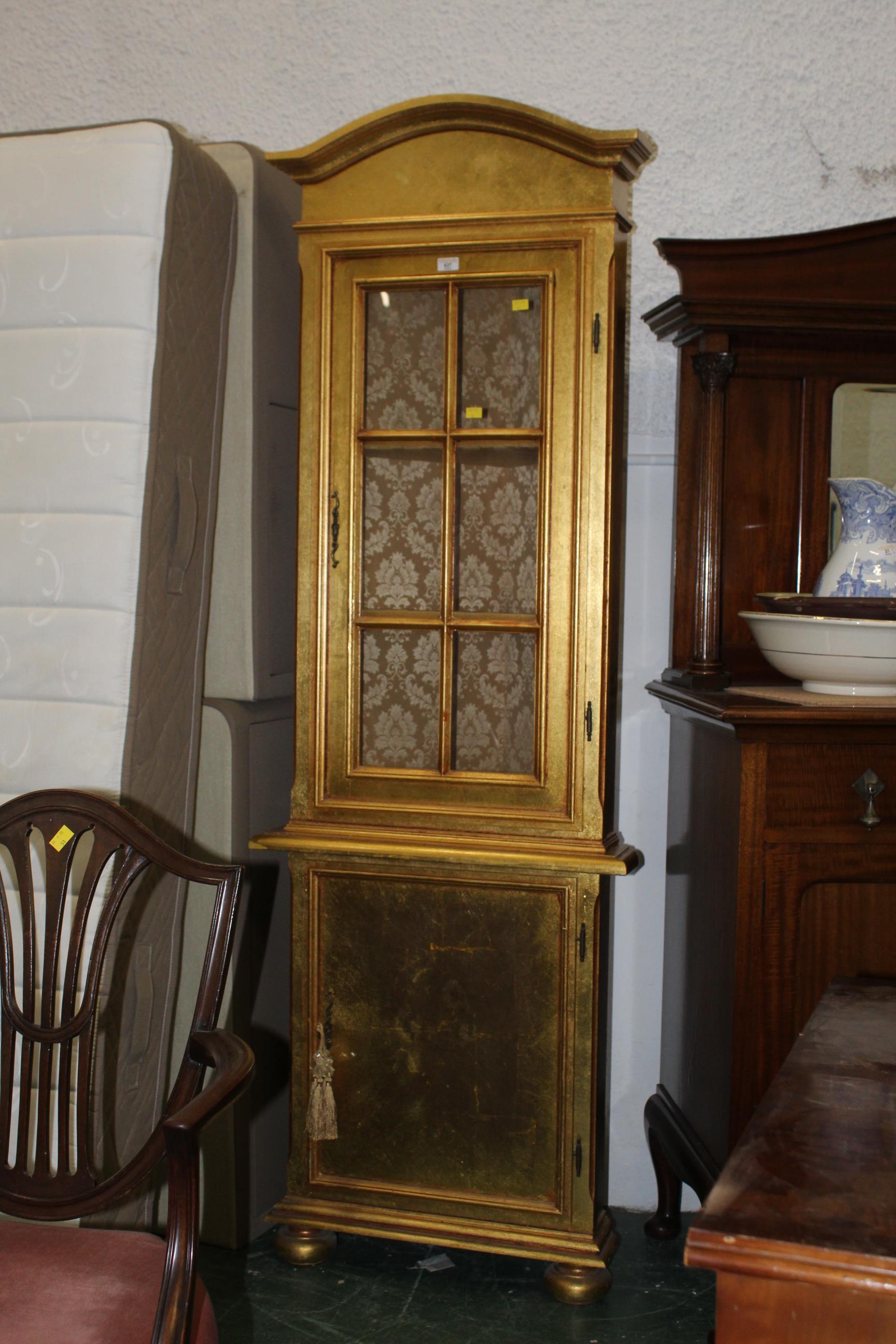 Gold painted freestanding glazed corner cabinet