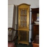 Gold painted freestanding glazed corner cabinet