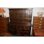 Oak carved dresser with linen fold cupboards