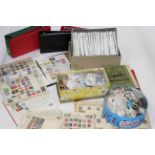 Box of stamps and empty stamp albums,