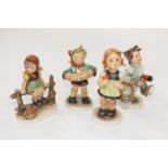 Four Hummel figures