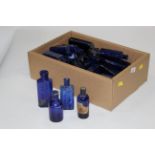 Box of blue apothecary bottles