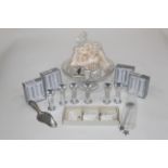 Box of glass tazza, cake pillars, cake decorations,