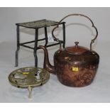 Brass and metal footman and copper kettle on stand