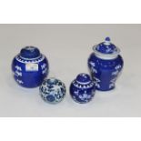 Four pieces of blue and white - a lidded vase, a smaller spherical vase, and 2 ginger jars,