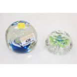 Two faceted glass paperweights