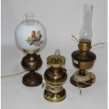 Three brass/copper oil lamps,