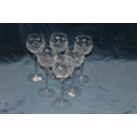 Six moulded glass wine glasses
