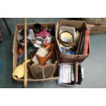 Three boxes of kitchenware, light shade, videos, tins,