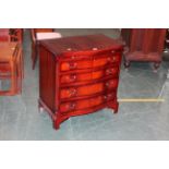 Reproduction serpentine fronted four drawer chest of drawers, height 77 cm,