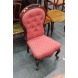 Victorian button back chair upholstered in red patterned material