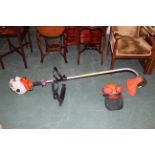 Stihl FS40 petrol strimmer and protective helmet