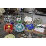 Seven collectible paperweights