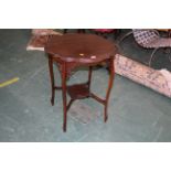 Edwardian mahogany shaped occasional table with tier below,