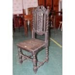 Carved oak chair with spindle supports