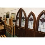 Pair of large arched stain glass doors,