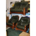 Oak framed three piece suite in green leather - 2 seater settee and 2 armchairs