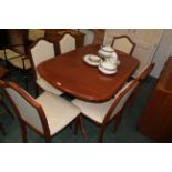 Regency style veneered dining table with 6 matching chairs,