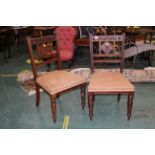 Pair of carved floral dining chairs with fabric seats