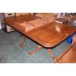 Victorian style mahogany extending dining table on claw & ball feet and with extra leaf,