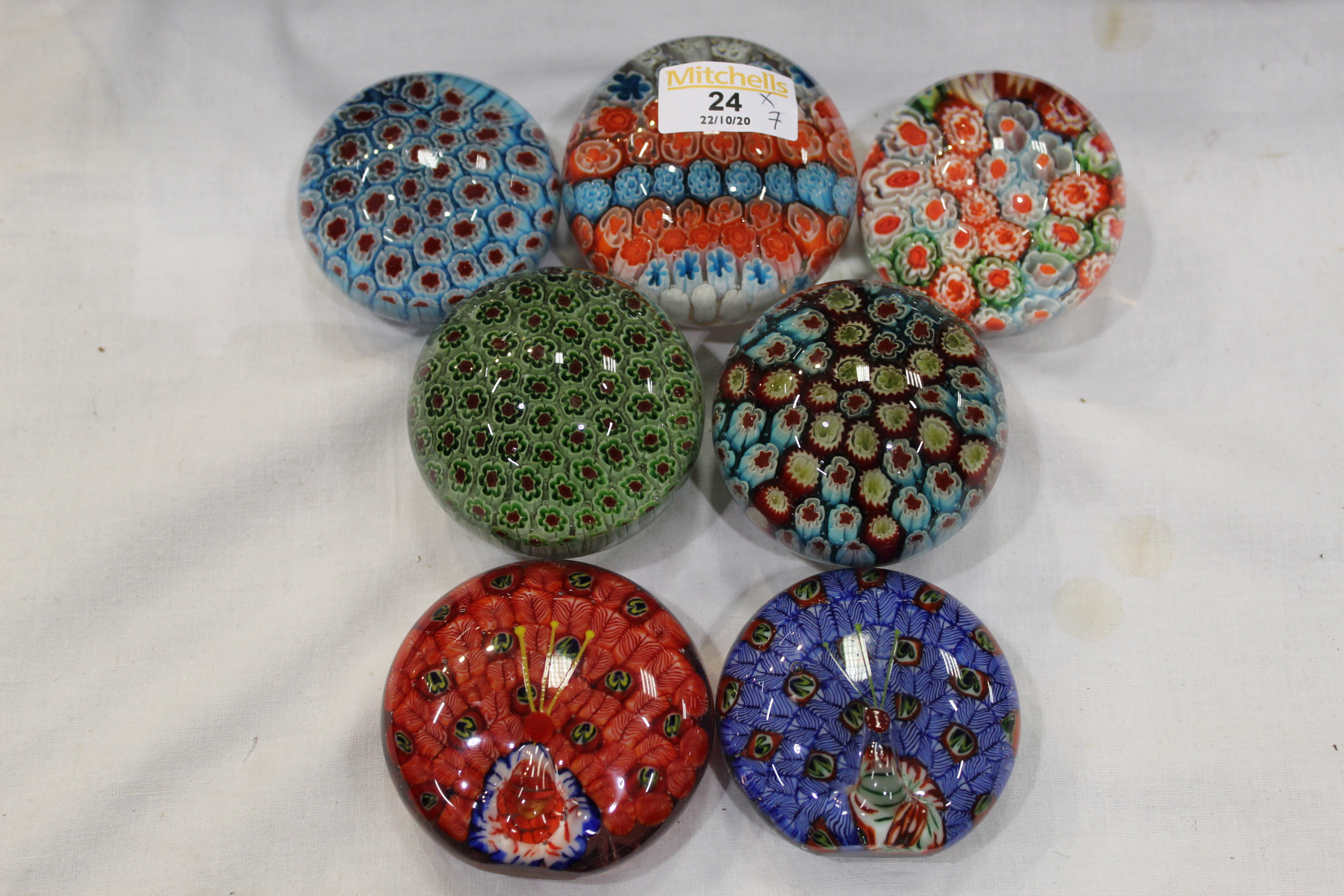 Seven Millefiori glass paperweights