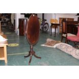 19th century oval topped tilt top tripod table