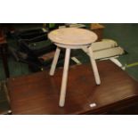 Dish topped three legged stool