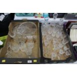 Two boxes of decanters, crystal and cut glass wine glasses, ship in a bottle,
