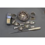 Box of silver items, napkin rings, bonbon dish, teaspoon, stainless steel letter opener,