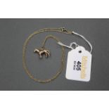 9 ct gold horse charm on yellow metal necklace, 4.