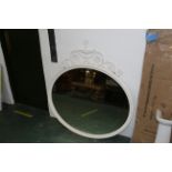 Large oval bevelled mirror in white decorative frame,