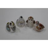 Four Royal Crown Derby bird ornaments all with gold stoppers