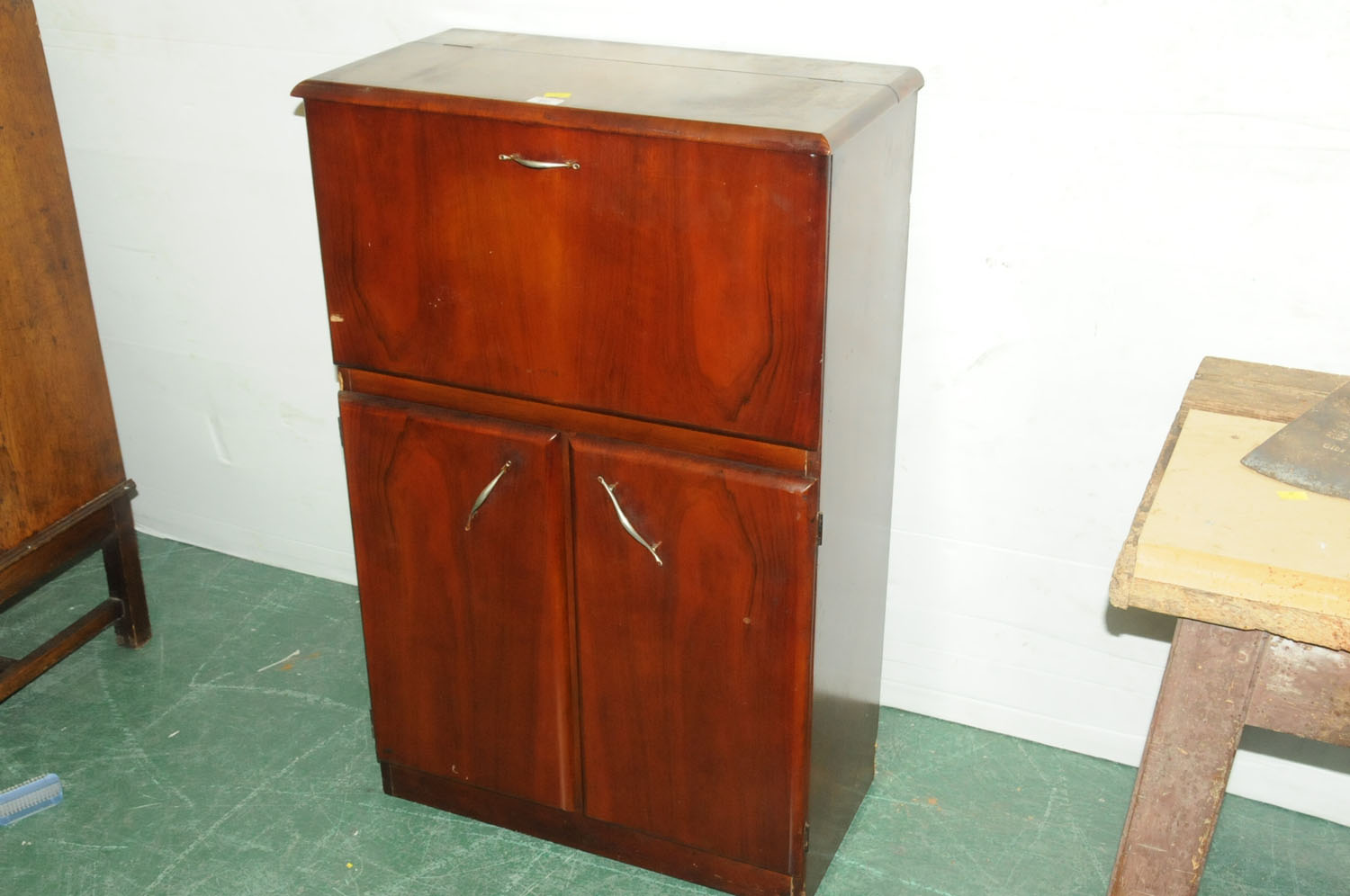 1950's walnut cocktail cabinet with fold down front and lift up top opening to mirrored interior