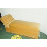 Daybed upholstered in light yellow velvet type material with lift up base