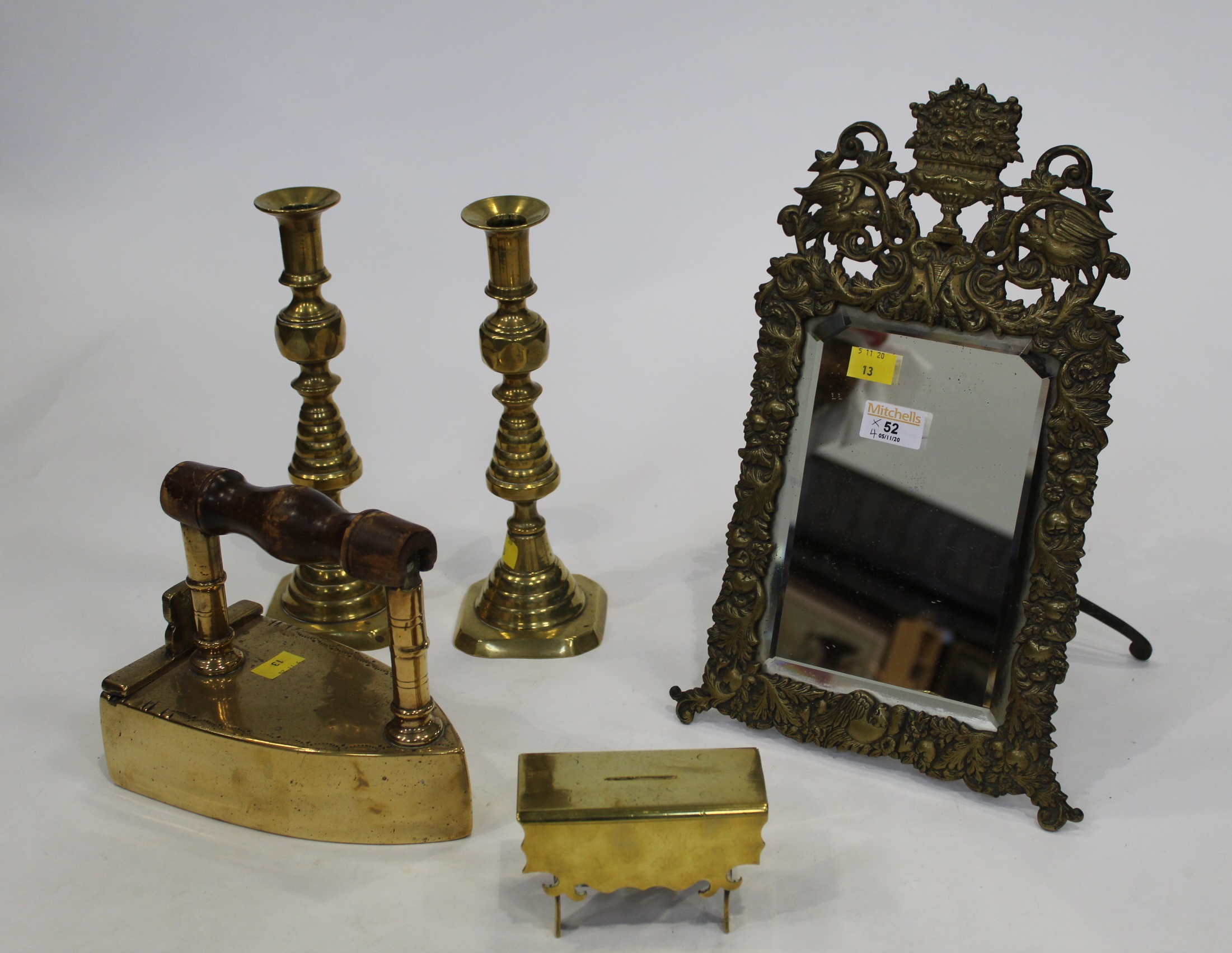 Brass decorative mirror, two candlesticks,