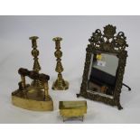 Brass decorative mirror, two candlesticks,