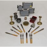 Box of brass candlesticks, cutlery, brass weights,