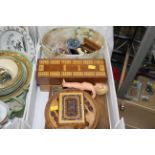 Box of cribbage board, marble stand, wooden card box, small trophy, hard plastic rose bud doll,