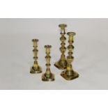 Two pairs of brass candlesticks