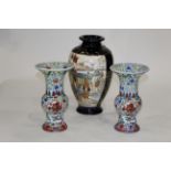 Pair of polychrome oriental vases with 6 figure character mark to base, height 24 cm,