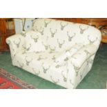 Two seater settee upholstered in stag patterned material
