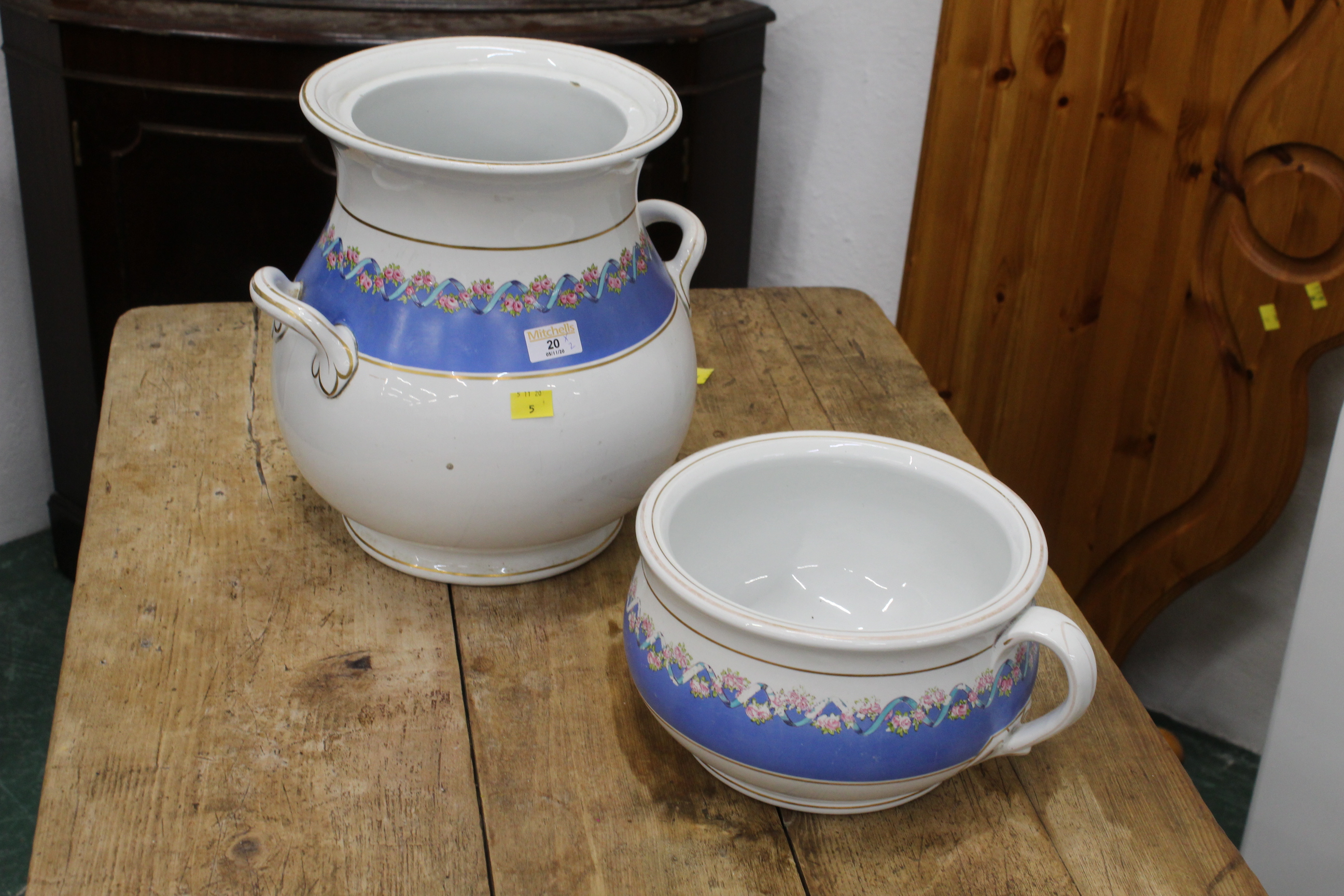 Floral jug with two carrying handles and a matching chamber pot,