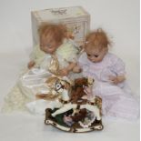 Box of modern porcelain collectors' dolls and Regency Fine Arts Teddy bear rocking horse ornament