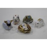 Five Royal Crown Derby ornaments/paperweights all with gold coloured stoppers