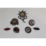 Bag of badges comprising floral metal badge, skull badge and 4 German Nazi badges,