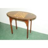 Edwardian oval games table raised on four legs