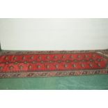 Red & blue patterned runner, length +/- 280 cm,