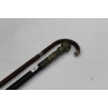 Walking stick with silver banded neck and ebonised walking cane with metal decorative grip,