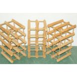 Three wooden wine racks